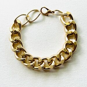 Chunky gold bracelet width 1.5 cm.